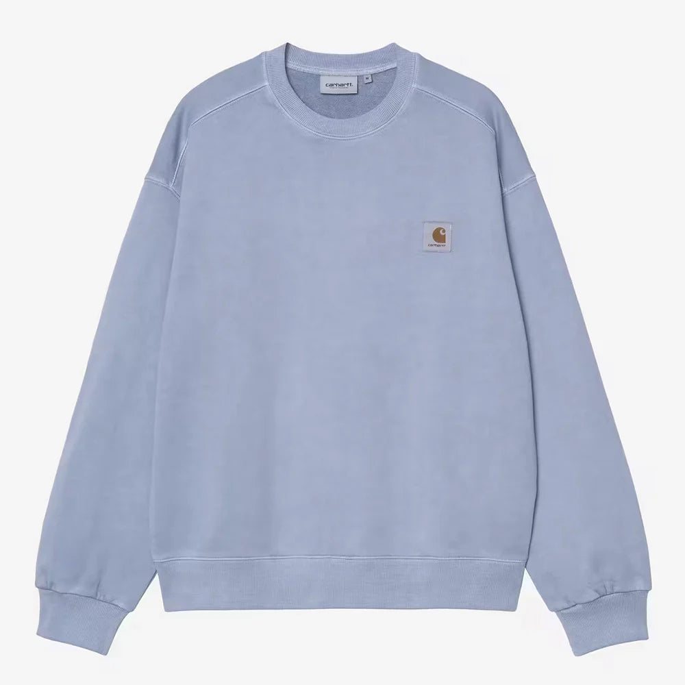 “Übersicht der Carhartt WIP Nelson Kollektion mit Fokus auf pigmentgefärbte Hoodies, Crewnecks, T-Shirts und Sweatpants im Boxy-Schnitt bei Stickabush Berlin.“