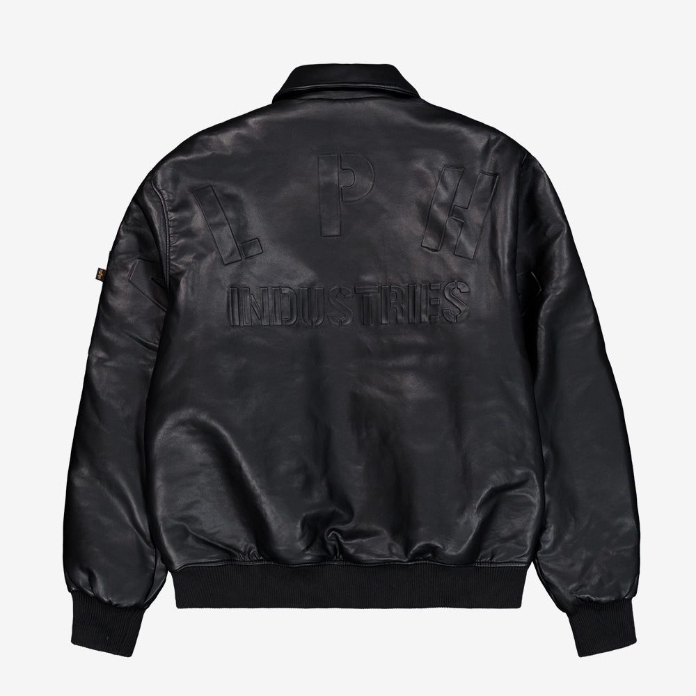 "Schwarze Bomberjacke aus Faux-Leder von Alpha Industries mit gerippten Bündchen, Utility Pocket und Schaumdruck.“