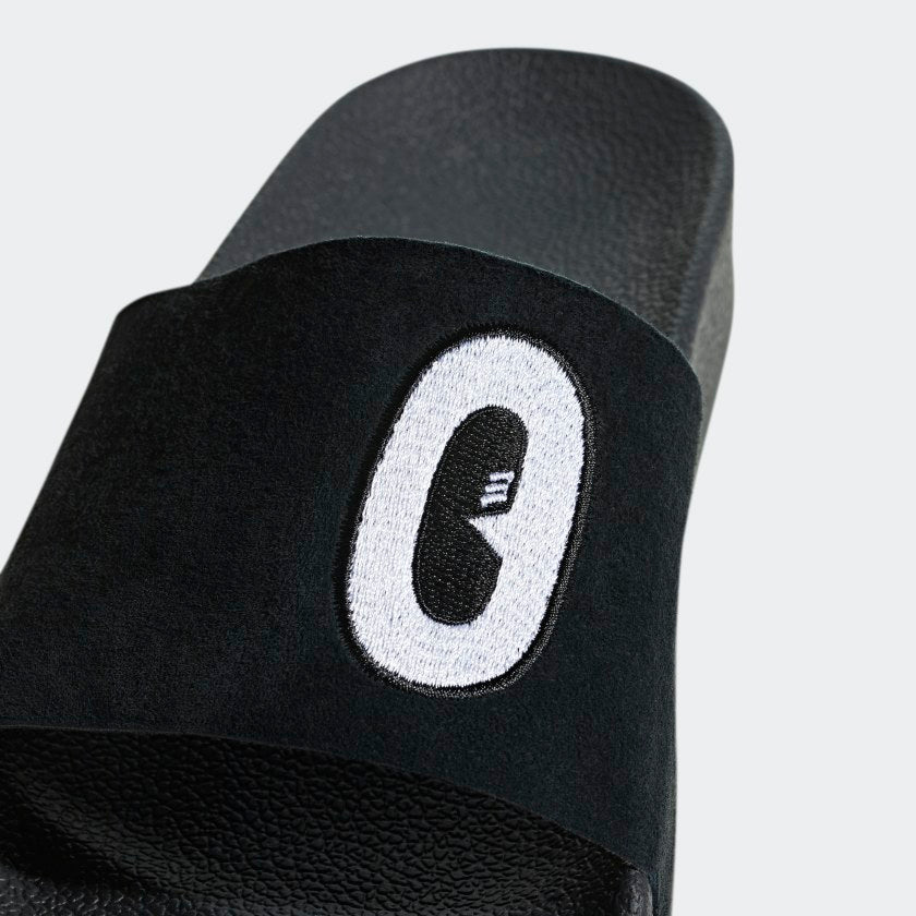 Adidas Adilette "Cartoon" W Core Black STAB Slipper Streetwear Shop Sneaker Store Adidas Schuhe stab retro sneaker air force one damen retro sneaker damen snkraddicted streetwear marken schuhe 80er jahre sneakerjagers adidas limited edition 80er schuhe retro sneaker seltene sneaker adidas sonderedition