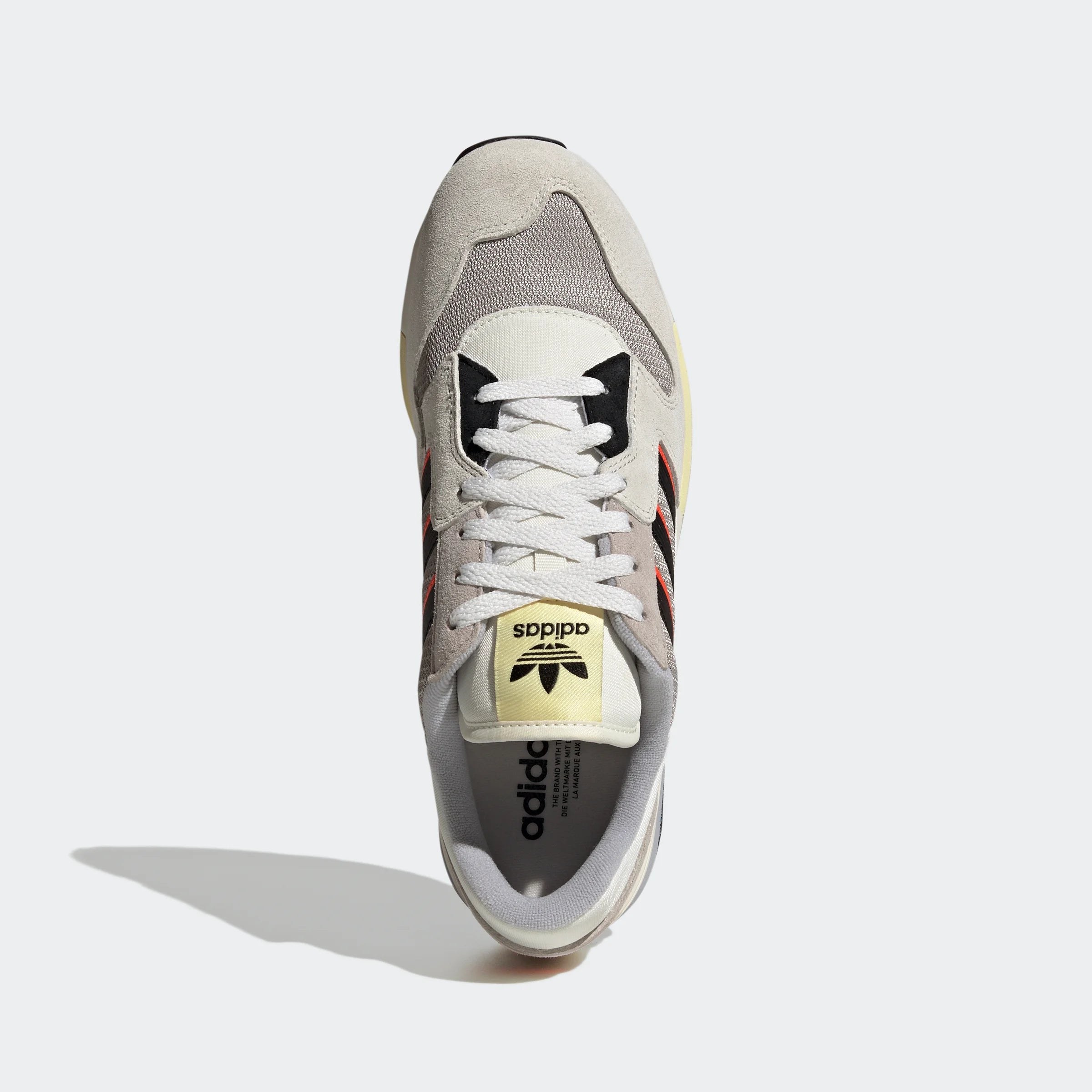 “Adidas ZX 420 Sneaker in Grau-Orange-Schwarz. Retro-Laufschuh aus Wildleder und Mesh mit EVA-Dämpfung bei Stickabush Berlin.“