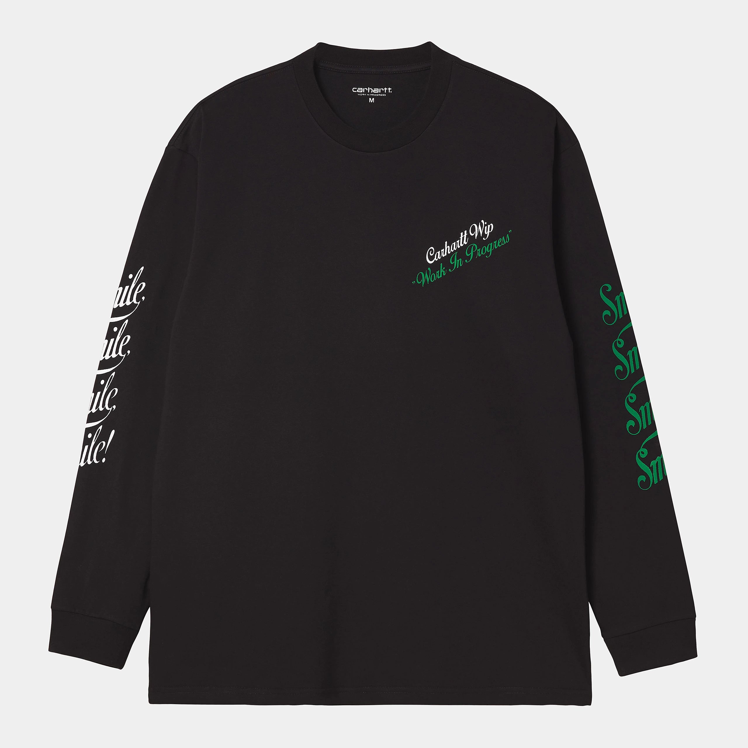 Carhartt WIP L/S Smile T-Shirt – Black. Schwarzes Langarmshirt aus Bio-Baumwolle, mit lockerem Schnitt und kleinem, weißem "Smile" Schriftzug auf der Brust.