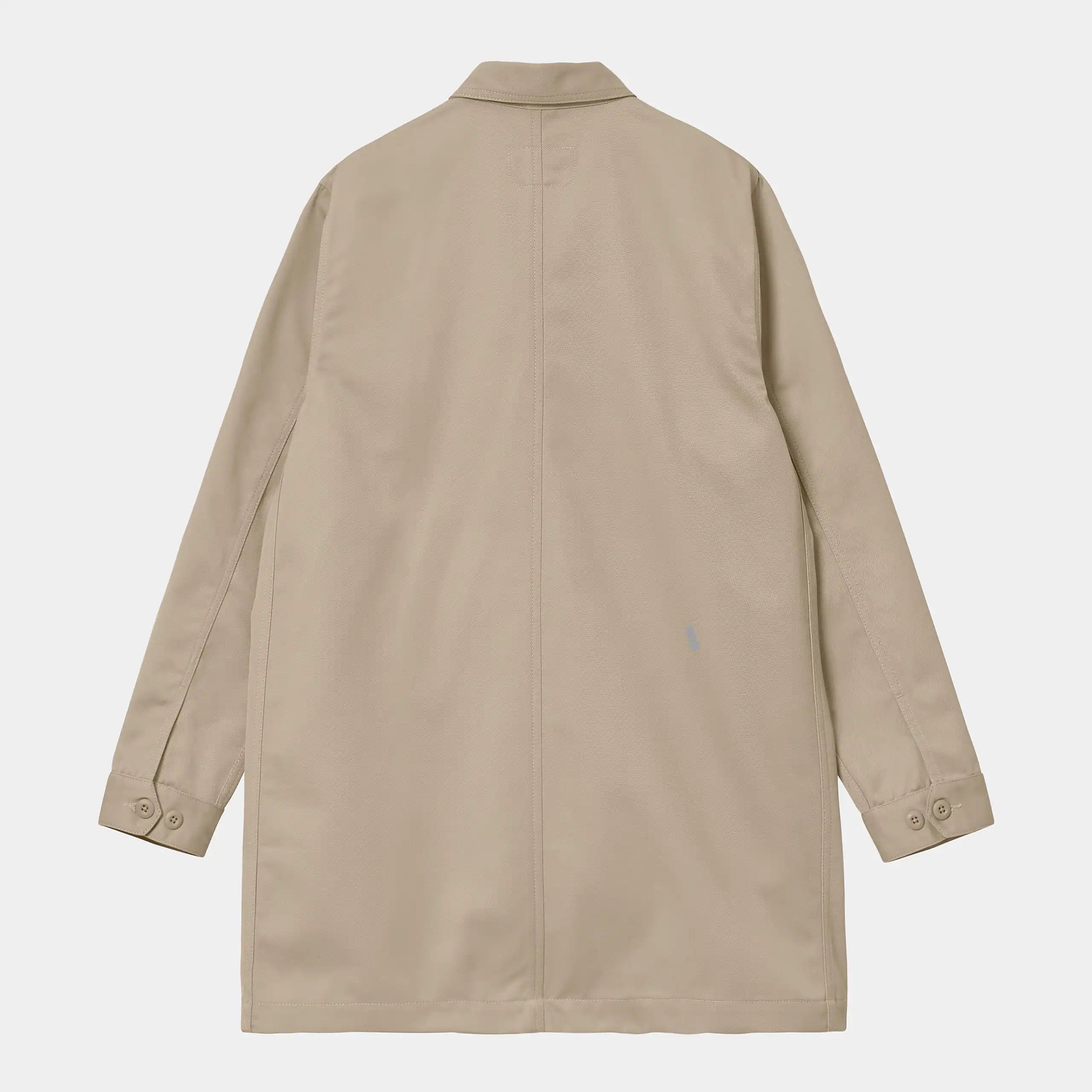 "Carhartt WIP Modular Coat – Wall. Beiger Mantel aus robustem Baumwoll-Twill, mit verdeckte Knopfleiste vorne und aufgesetzten Taschen."