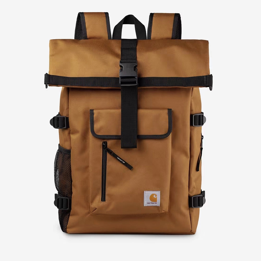 “Carhartt WIP Philis Backpack in Hamilton Brown mit Roll-Top Verschluss und quadratischem Carhartt Logo-Label bei Stickabush Berlin.“