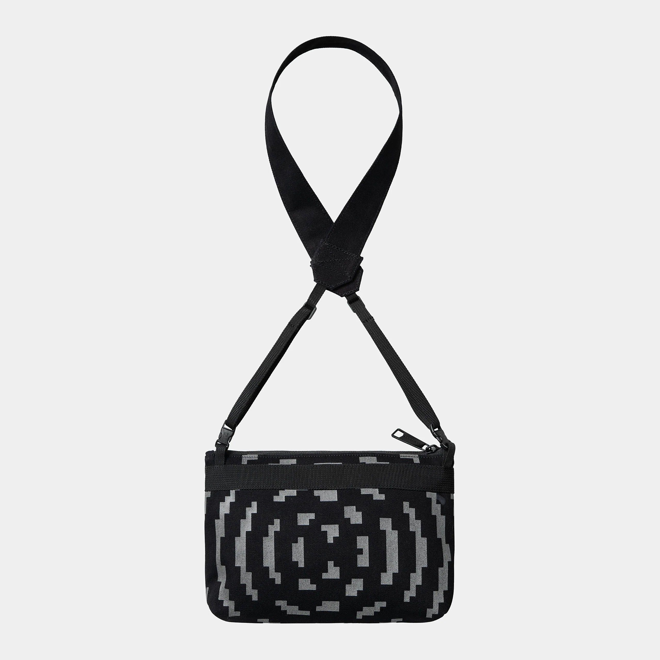 "Carhartt WIP x TRESOR Way Of The Light Strap Bag, Schwarz/Dunkelgrau reflektierend, kleine Umhängetasche mit reflektierenden Details und Logos."