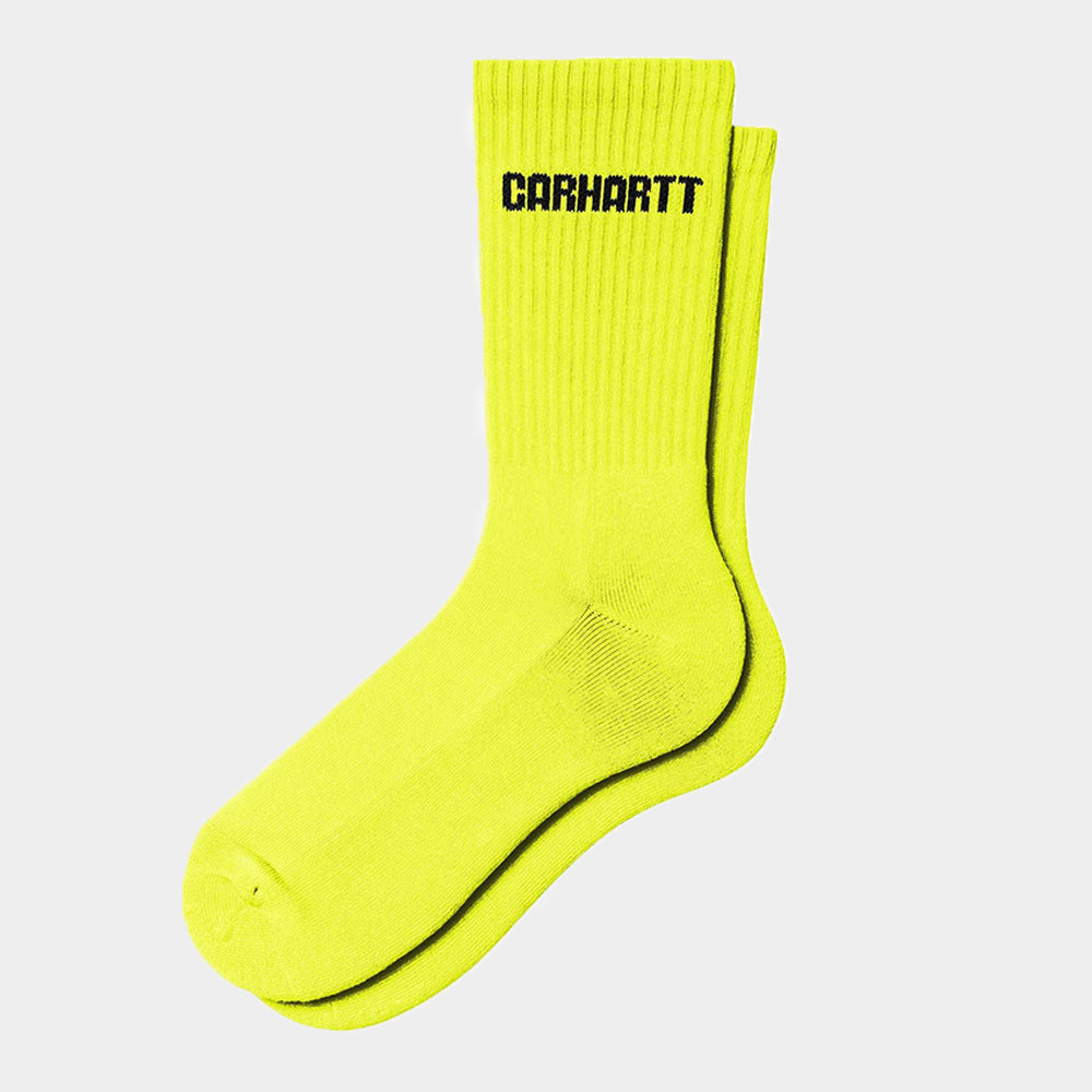 “Carhartt WIP Industry Socks – Lumo Yellow / Black. Neongelbe Socken mit schwarzen Details, geripptem Schaft und Carhartt WIP Logo.“