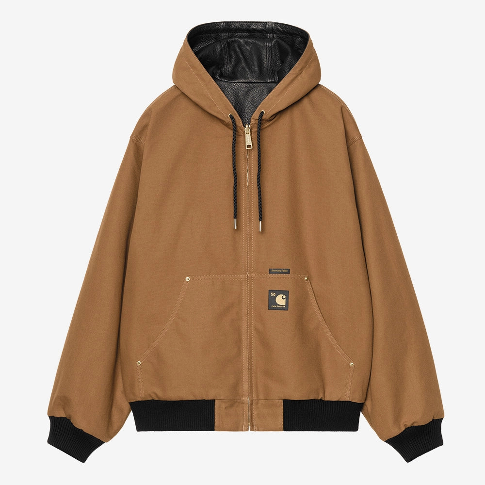 Carhartt WIP OG Active Jacket 50 Years Anniversary in Schwarz, Premium-Leder, mit Hamilton Brown Innenfutter und Kapuze.