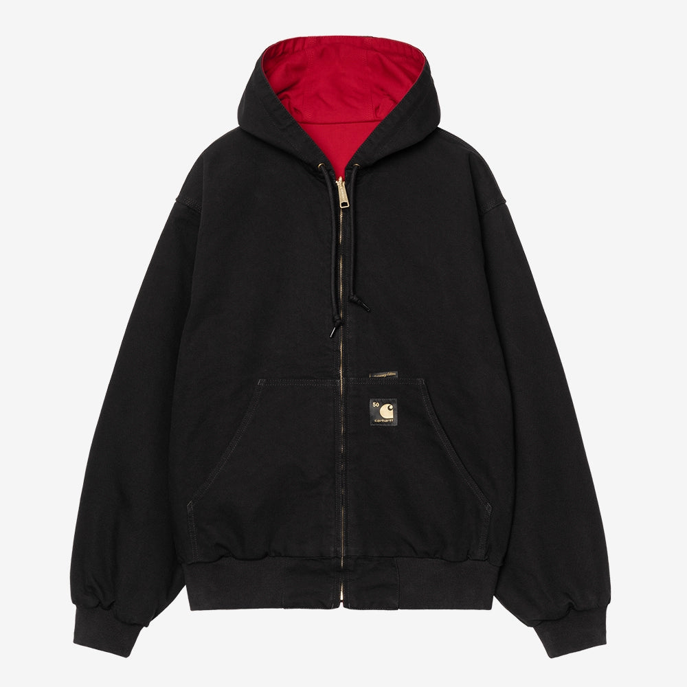 Carhartt WIP OG Active Jacket 50 Years Anniversary in Schwarz, aus Canvas, mit USA Red Innenfutter und Kapuze, rinsed.