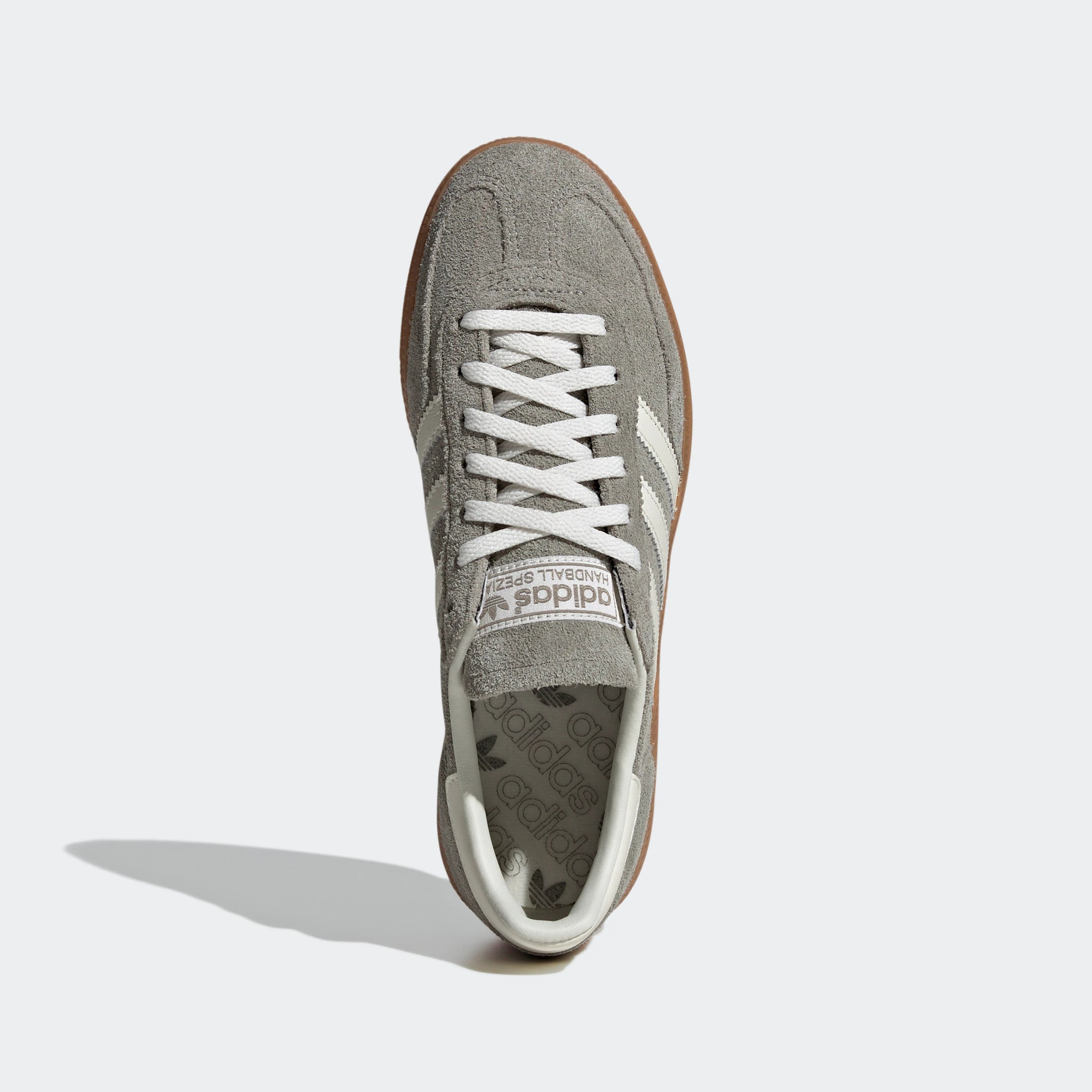 "Adidas Handball Spezial Grau/Weiß IG1966: Legendärer Retro-Sneaker mit Wildleder-Upper, Gummisohle und 3-Streifen Look."