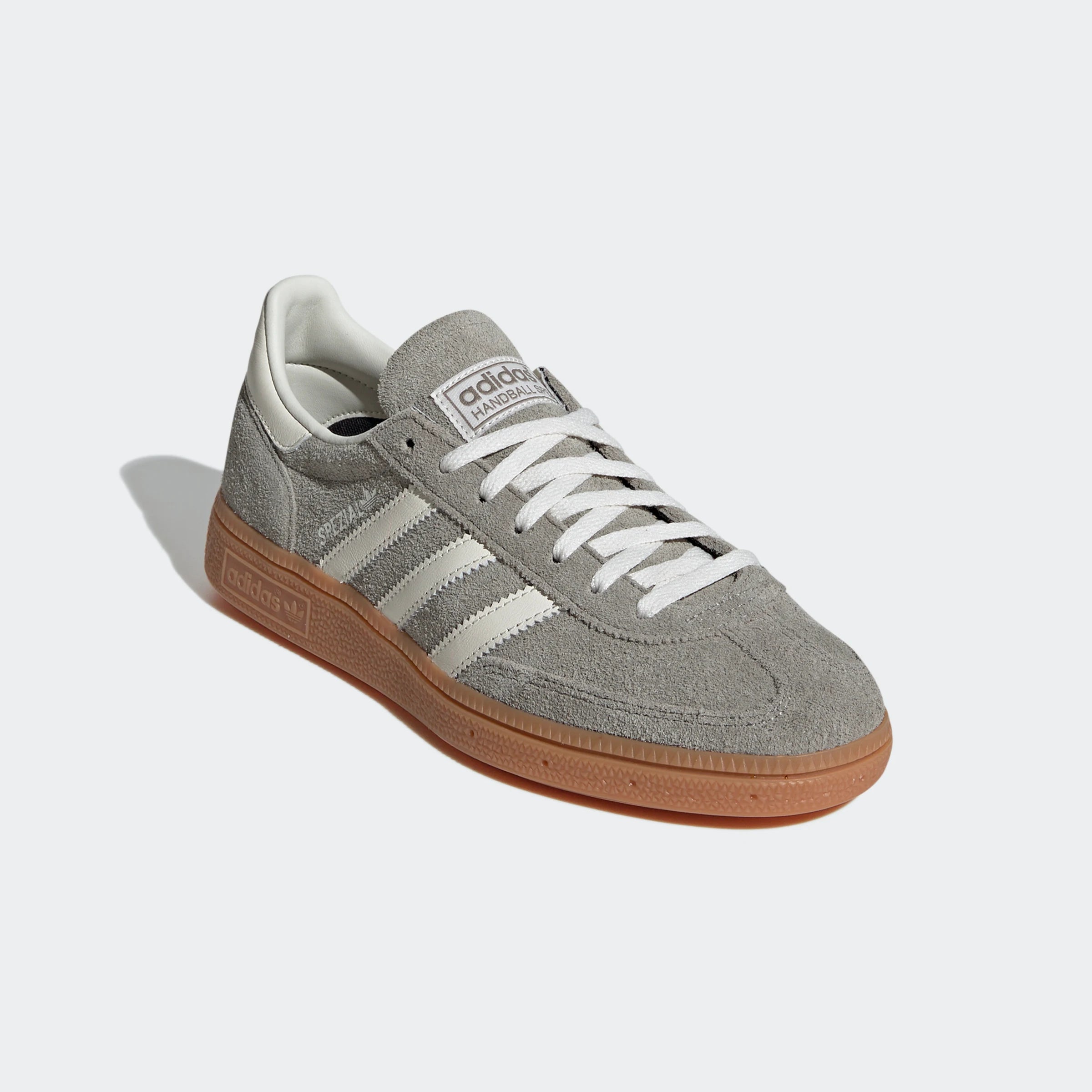 "Adidas Handball Spezial Grau/Weiß IG1966: Legendärer Retro-Sneaker mit Wildleder-Upper, Gummisohle und 3-Streifen Look."