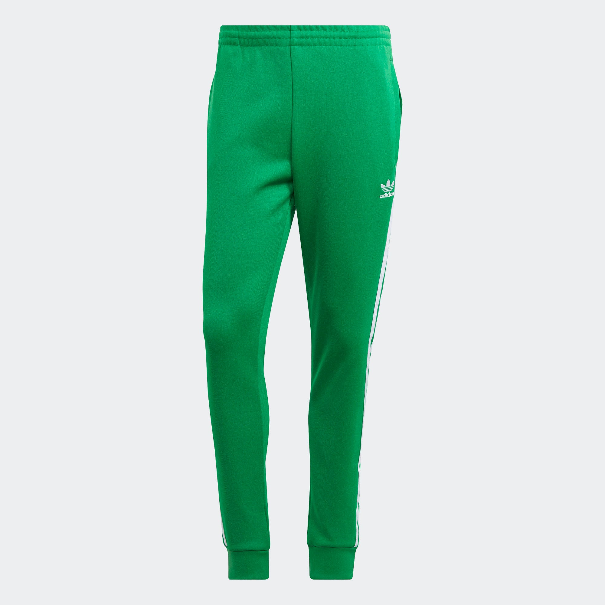 "Adidas Classics SST Track Pants in Grün, IK3515, aus Polyester/Baumwolle, schmal geschnitten, klassische adidas Trainingshose mit Streifen."