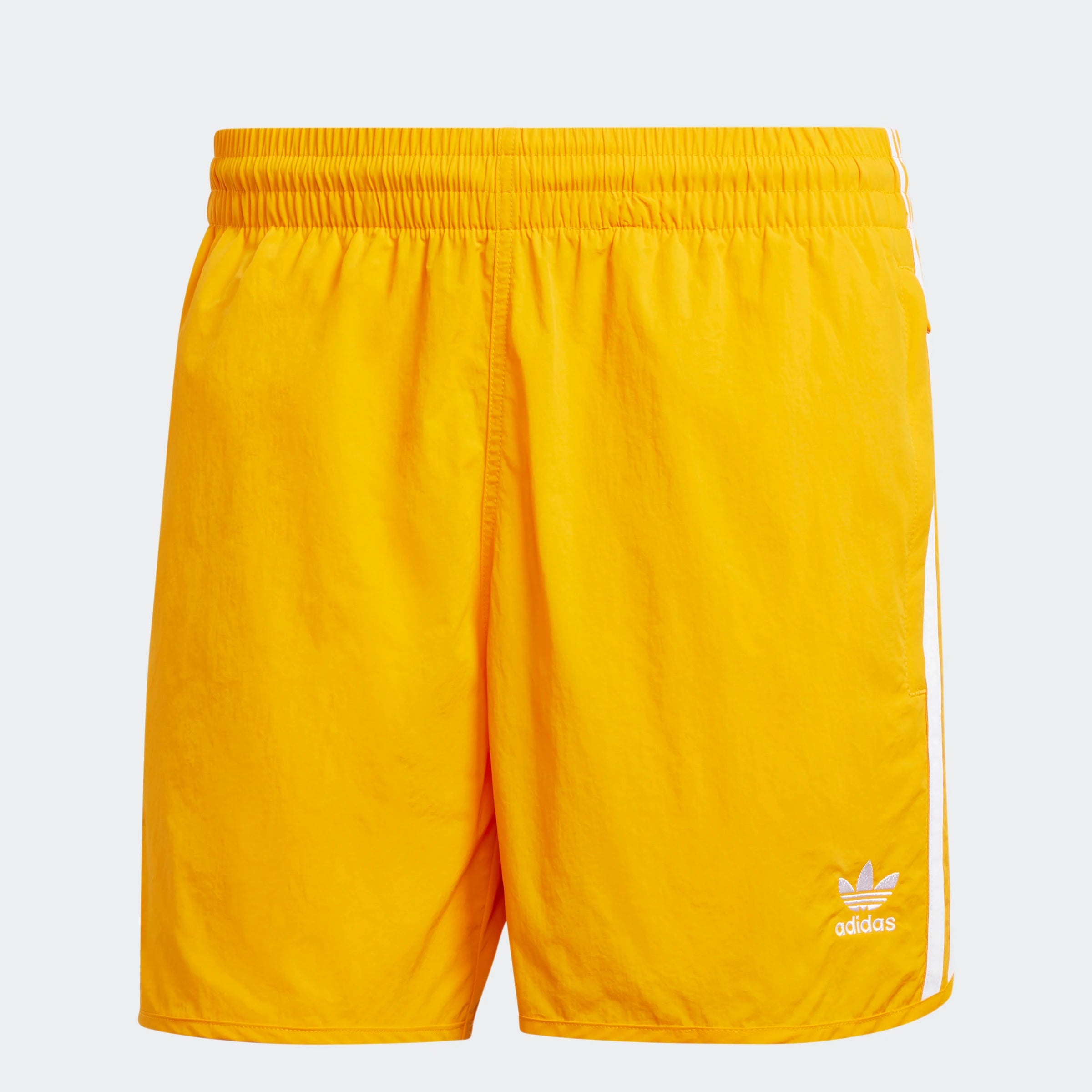 "Leuchtend orangefarbene Adidas Sprinter Shorts. Kurze, sportliche Hose mit elastischem Bund und kleinem, farblich passendem Adidas Logo am Bein."