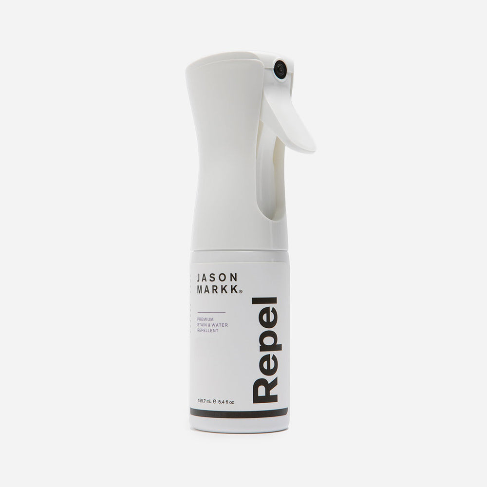 “Weiße Jason Markk Repel Spray Flasche mit weißem Etikett und schwarzem Logo, 159,7 ml Inhalt, für Schuhe.“