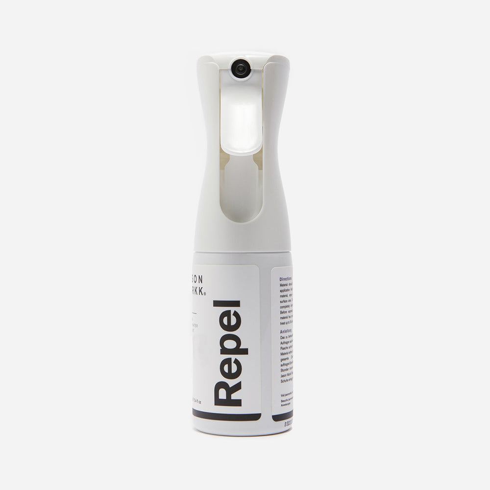 “Weiße Jason Markk Repel Spray Flasche mit weißem Etikett und schwarzem Logo, 159,7 ml Inhalt, für Schuhe.“