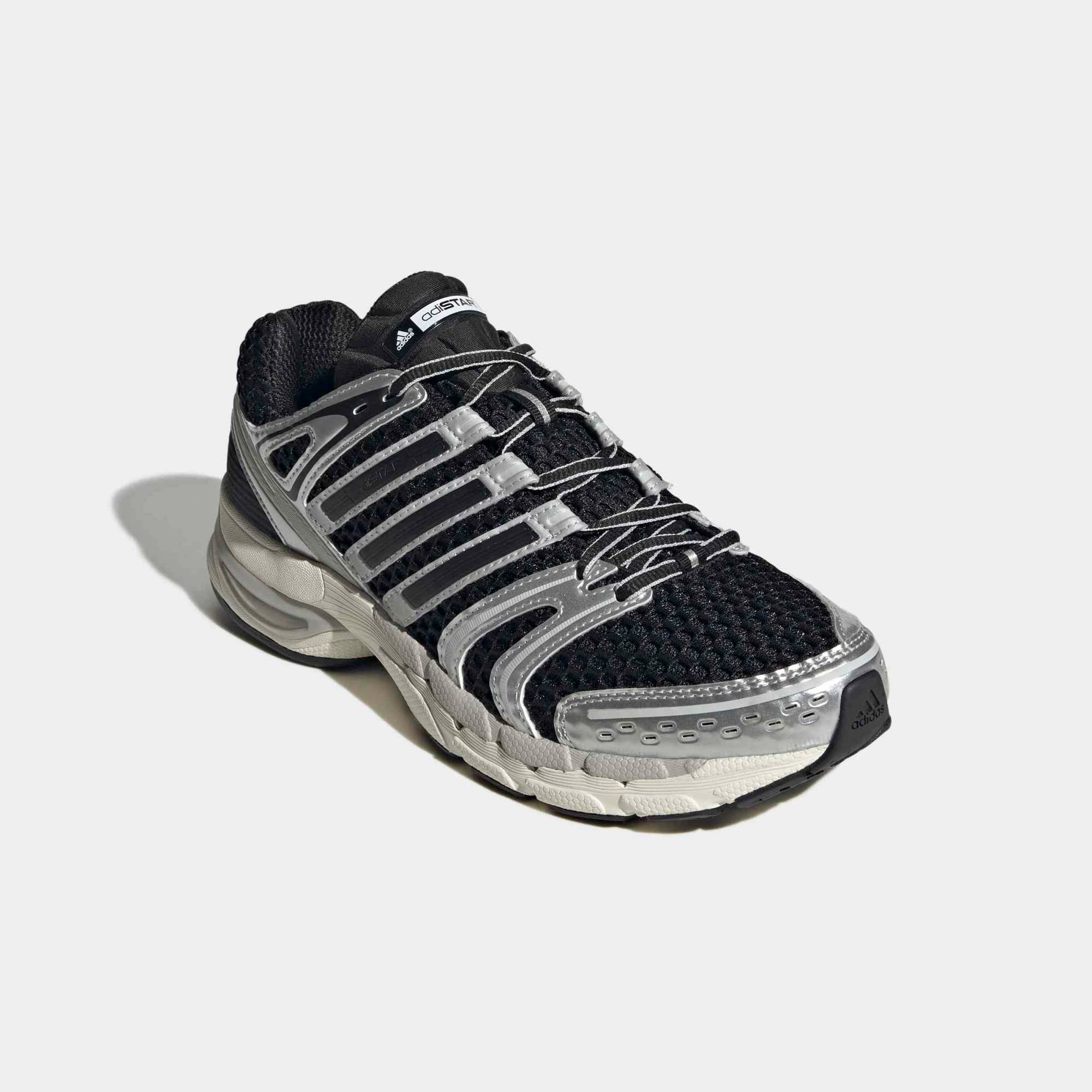 “Adidas Originals Adistar Control 5 Sneaker in Core Black, Silver Metallic, Grey One mit Mesh-Obermaterial und Chunky-Sohle, Retro Running Design bei Stickabush Berlin.“