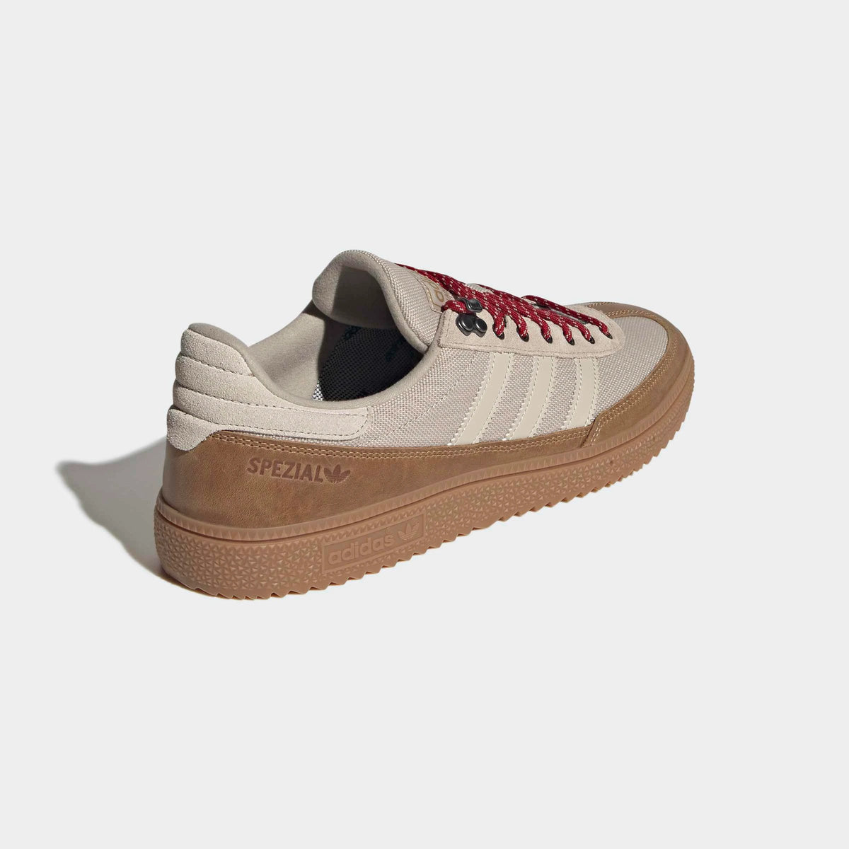 adidas Originals Handball Spezial WTR in Khaki Three / Bliss / Light Cinnamon – Rueckansicht des khakifarbenen Retro-Sneakers mit Metallösen und charakteristischen 3-Stripes.