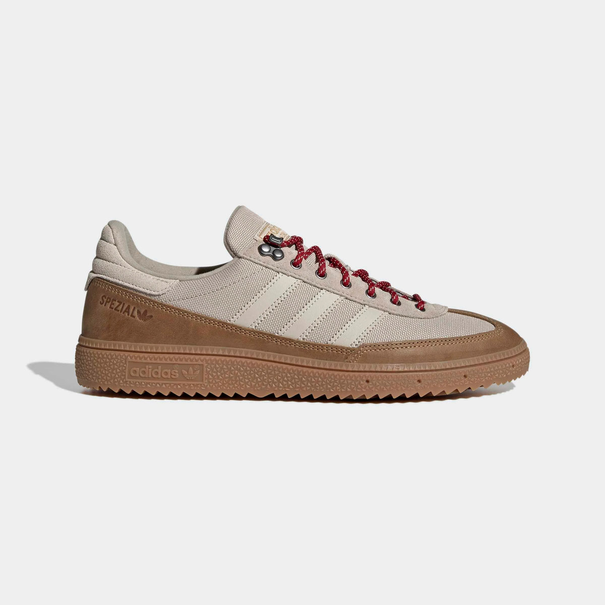 adidas Originals Handball Spezial WTR in Khaki Three / Bliss / Light Cinnamon – Seitenansicht des khakifarbenen Retro-Sneakers mit Metallösen und charakteristischen 3-Stripes.