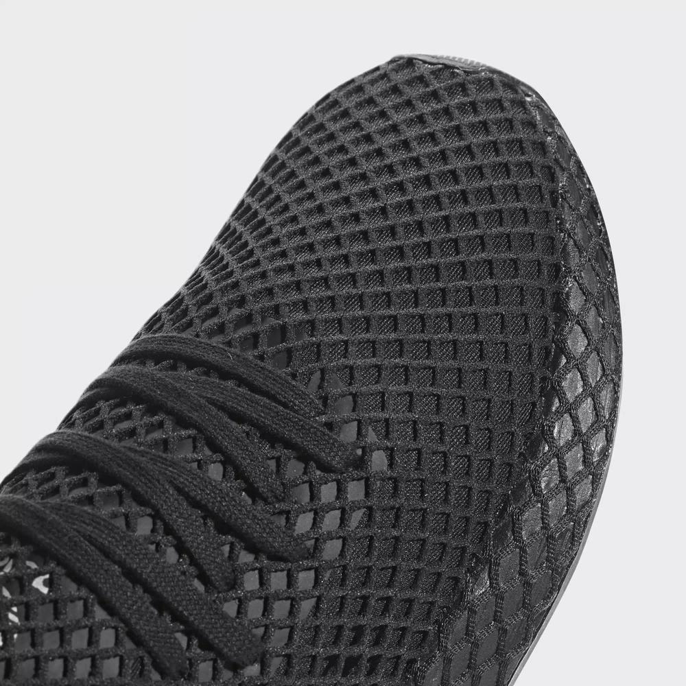 "Adidas Deerupt Runner J, Core Black/Ftwr White, Textil, auffälliger Sneaker in Schwarz-Weiß mit netzartiger Gitterstruktur."