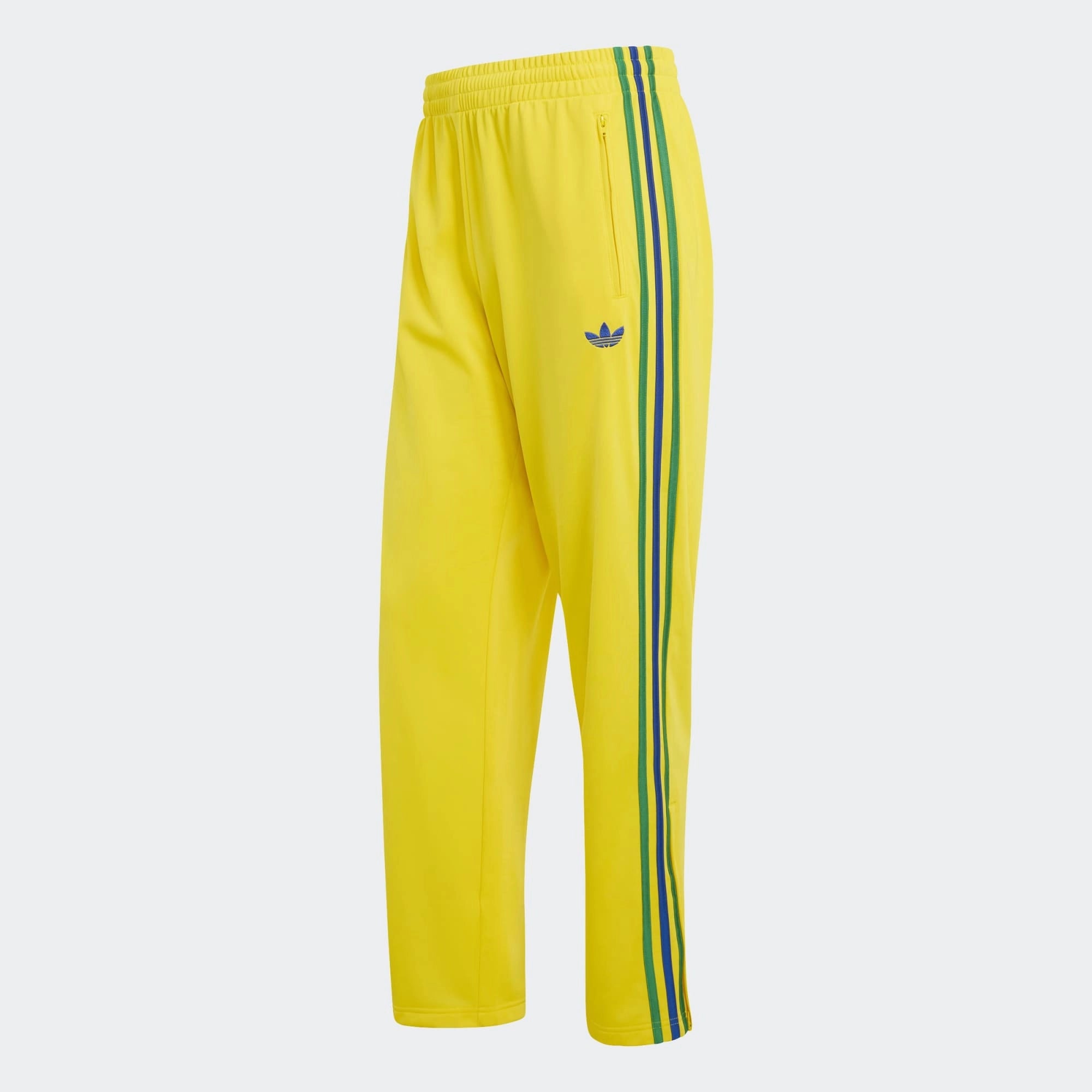 „Gelbe adidas Originals Firebird Damen Track Pants (KD8340) mit grünen Streifen und Details in Collegiate Royal Blau – bunte Retro-Trainingshose erhältlich bei Stickabush Berlin.“
