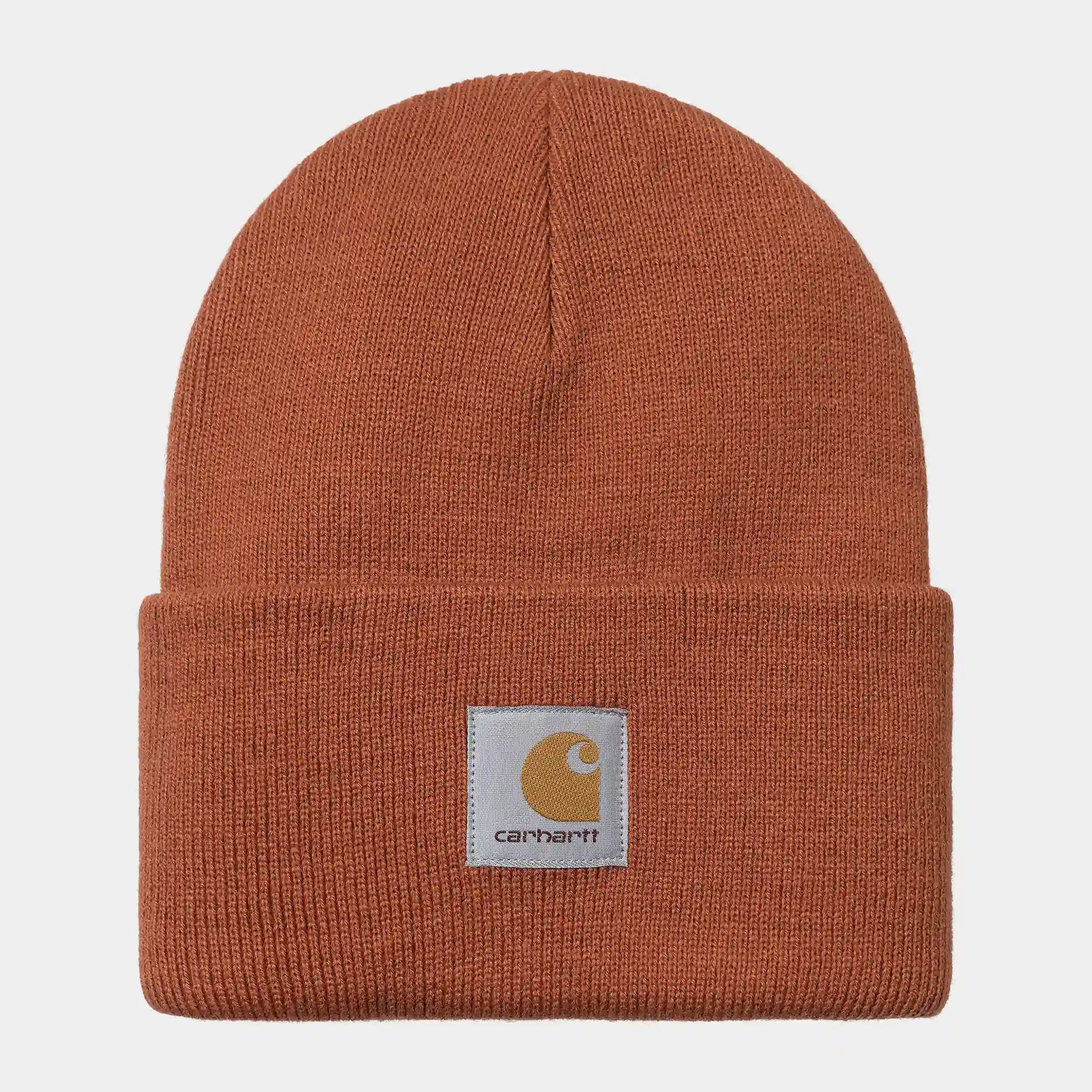 “Orangefarbene Carhartt WIP Acrylic Watch Hat in "Phoenix". Klassische, gerippte Strickmütze aus warmem Acryl, mit umschlagbarem Bund und kleinem, gewebtem Carhartt Square Label.“