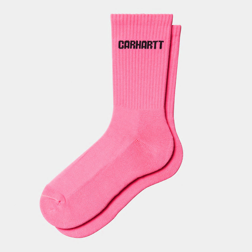"Carhartt WIP Industry Socks – Lumo Pink / Black. Leuchtend pinke Socken aus Baumwollmischung mit schwarzem Zehen-/Fersenbereich und Carhartt WIP Logo.“