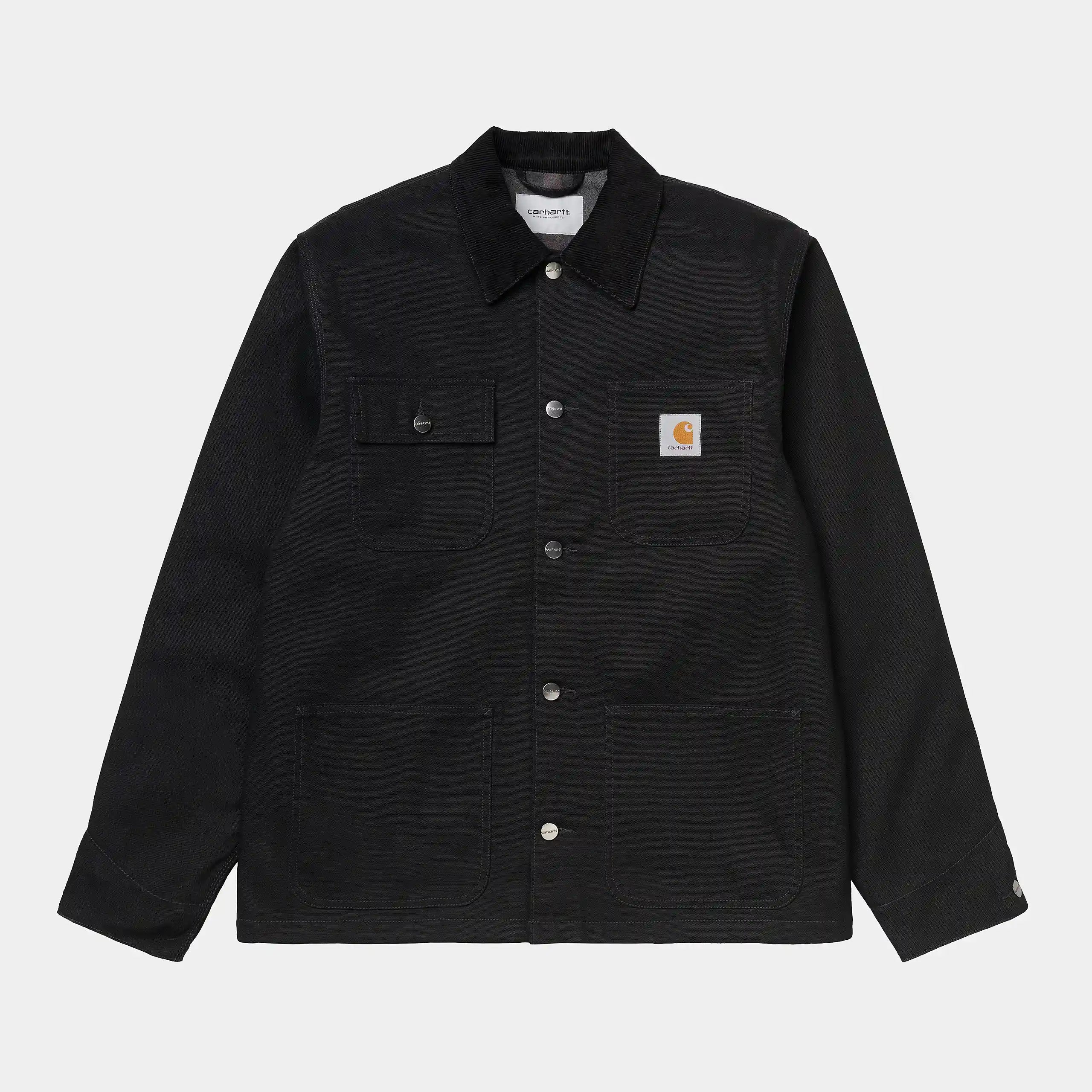 “Schwarzer ("rigid") Carhartt WIP Michigan Coat (Winter). Robuste Winterjacke aus ungefärbtem Baumwoll-Canvas, mit Steppfutter, Knopfverschluss und vier aufgesetzten Taschen.“