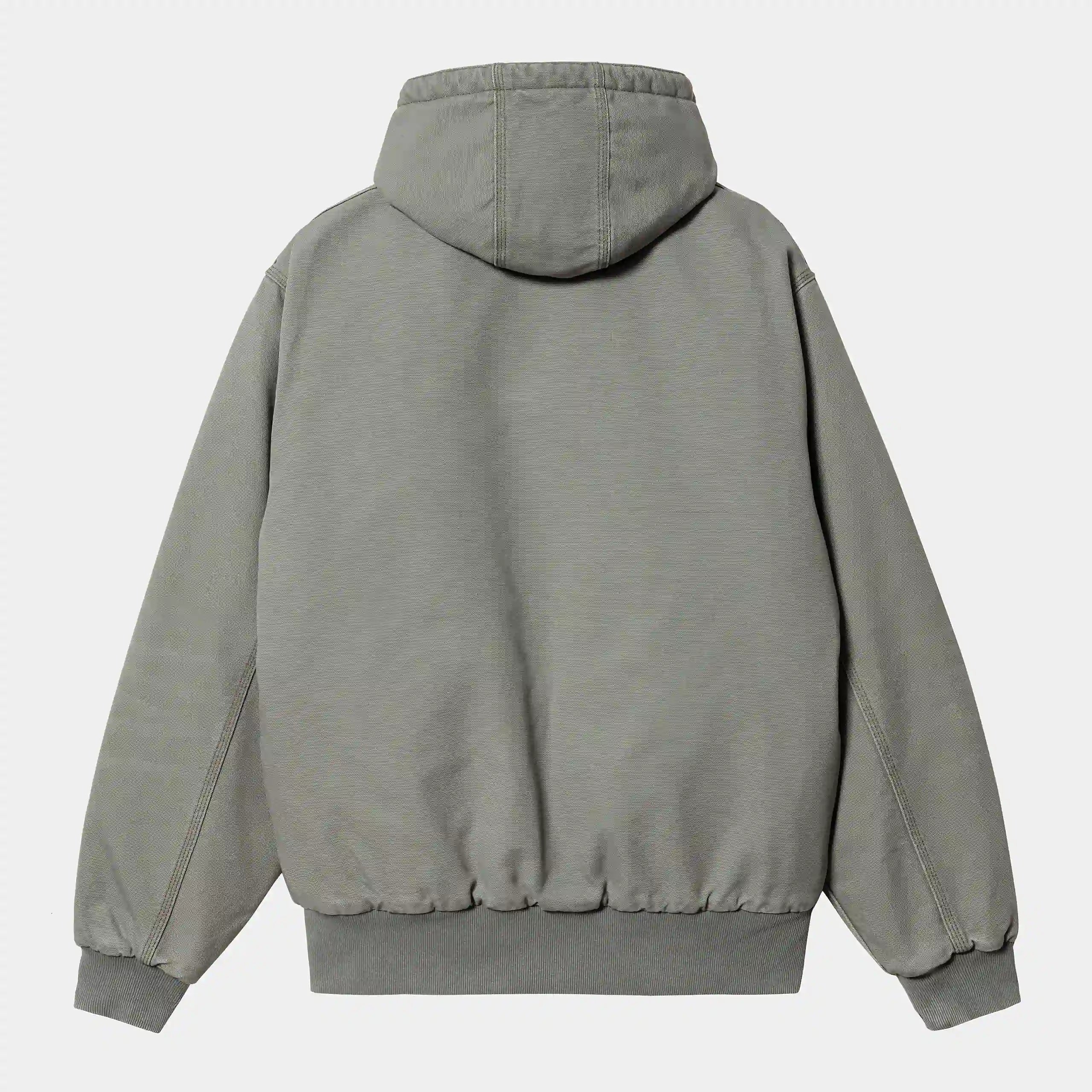 Grüne ("Smoke Green aged canvas") Carhartt WIP OG Active Jacket. Robuste Kapuzenjacke aus schwerem Baumwoll-Canvas, mit Steppfutter, Kängurutaschen und gewebtem Square Label.