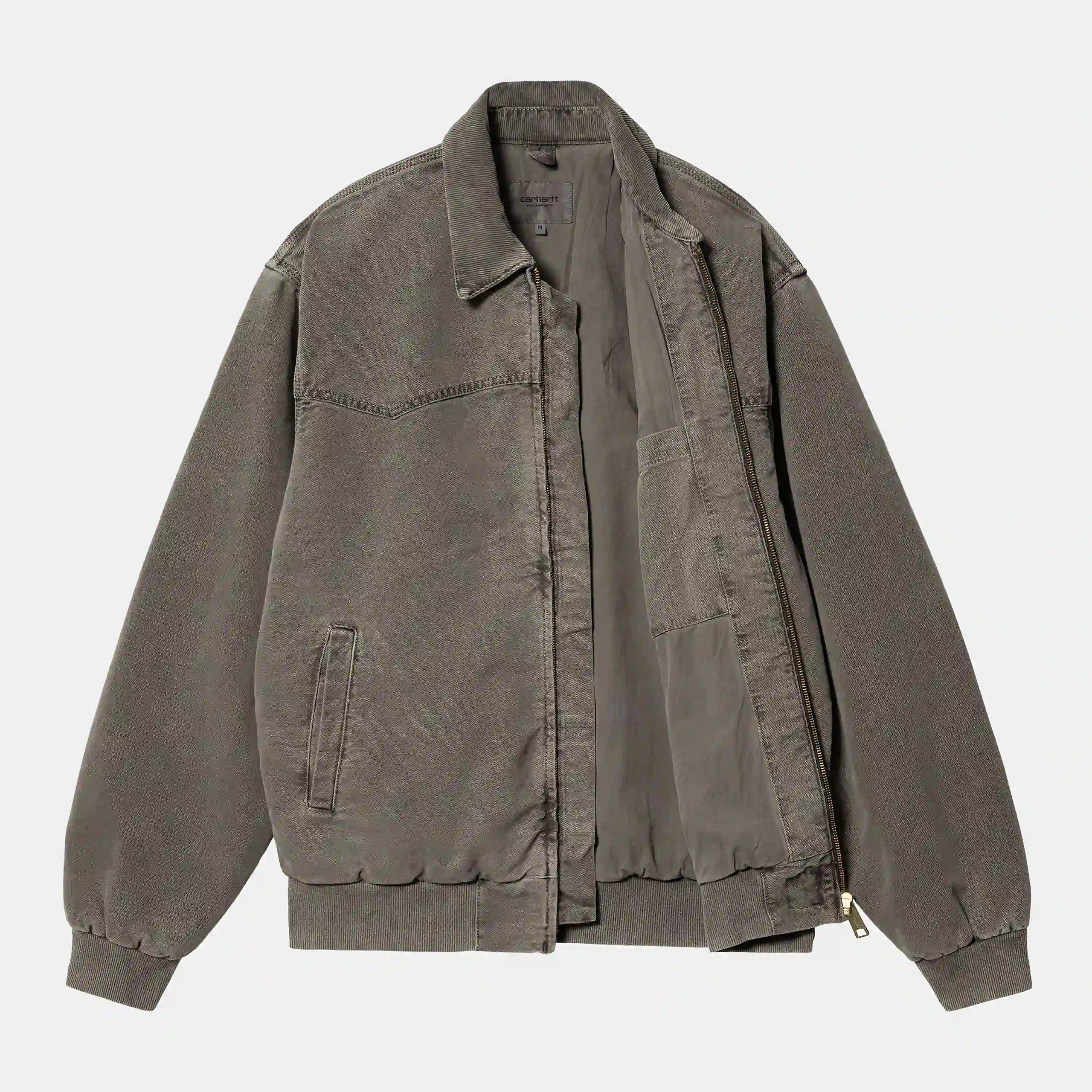 “Verblasste schwarze ("faded") Carhartt WIP OG Santa Fe Jacket. Robuste Jacke aus Baumwoll-Canvas mit Cordkragen, Steppfutter, Reißverschluss und gewebtem Square Label.“