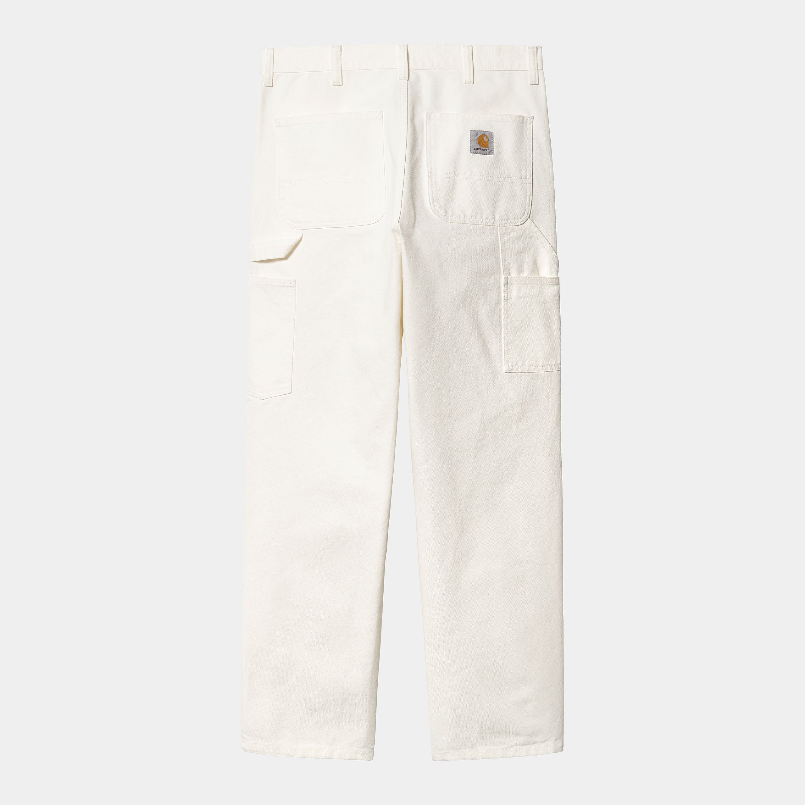 “Carhartt WIP Single Knee Pant – Wax (stone washed). Beige Worker-Jeans aus robustem Baumwoll-Twill, mit geradem Bein und Nieten-Details.“