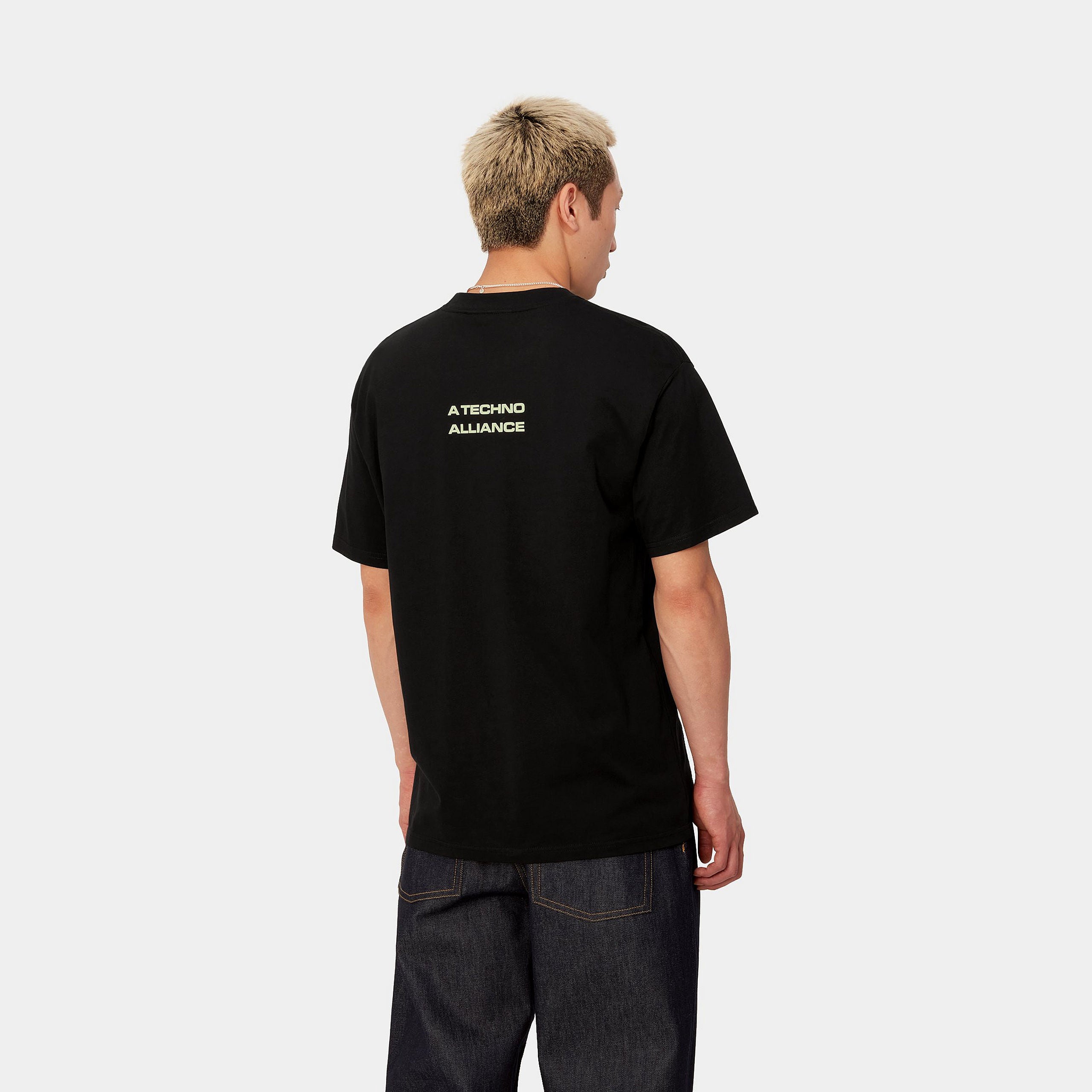 "Carhartt WIP x TRESOR Techno Alliance S/S T-Shirt, Schwarz/Glow Green, Baumwolle, Kurzarmshirt mit leuchtend grünem Print und Co-Branding."
