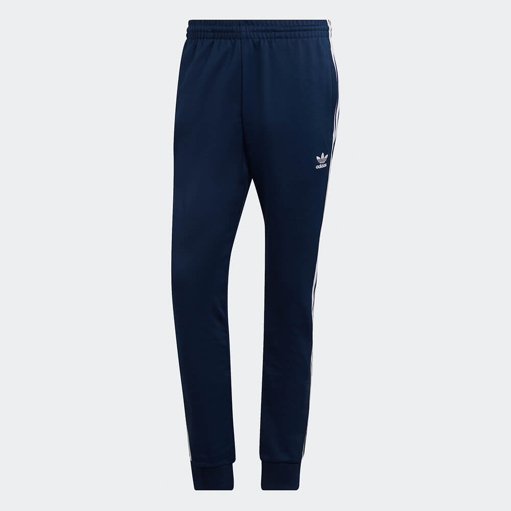 "Adidas Classics SST Track Pants in Blau, HK7353, aus Polyester/Baumwolle, schmal geschnitten, klassische adidas Trainingshose mit Streifen."