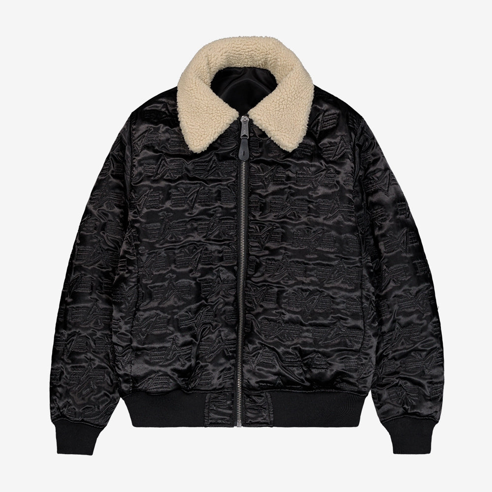 "Schwarze, wendbare Bomberjacke aus Nylon mit abnehmbarem Fellkragen, Utility Pocket und Rippbündchen.“
