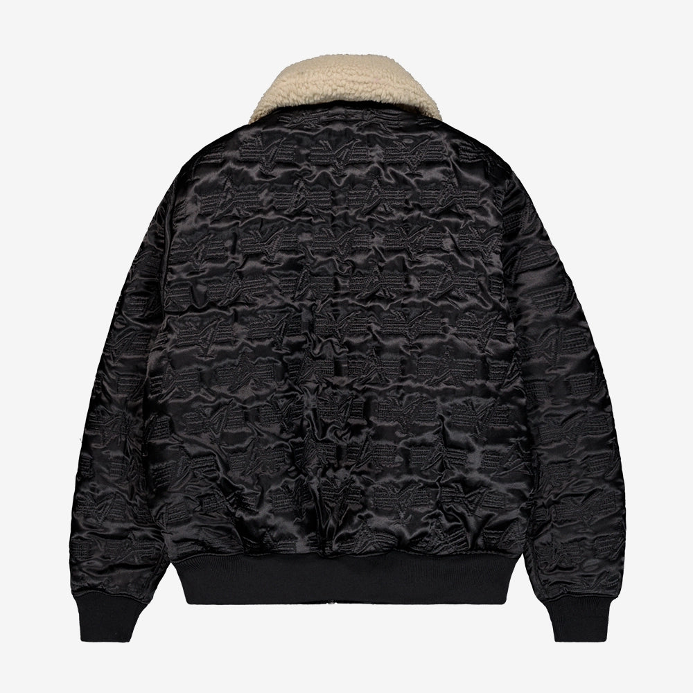 "Schwarze, wendbare Bomberjacke aus Nylon mit abnehmbarem Fellkragen, Utility Pocket und Rippbündchen.“