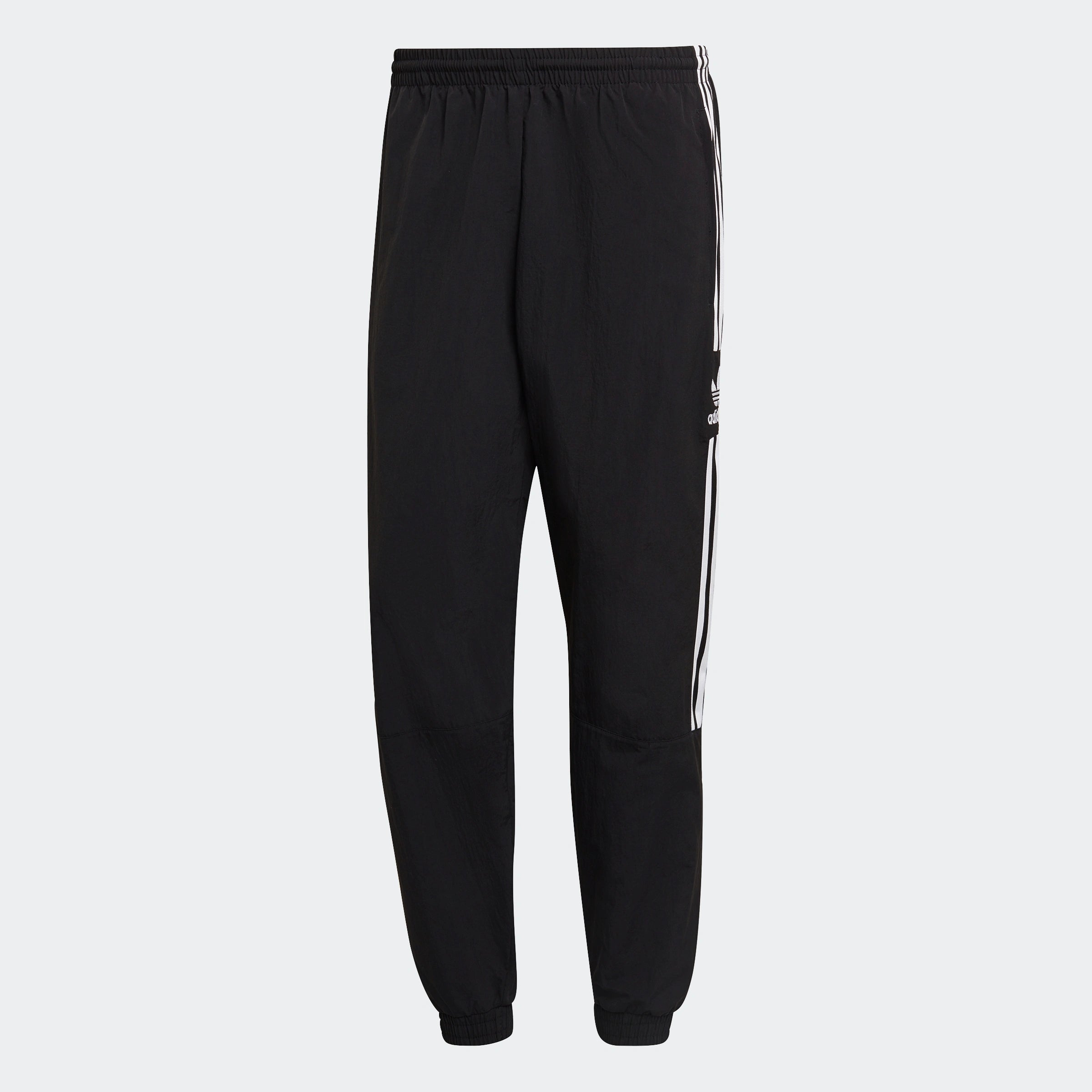 "Schwarze Adidas Trainingshose mit weißen seitlichen Streifen und weißem Trefoil-Logo am Bein. Klassischer Schnitt mit elastischem Bund und Bündchen."