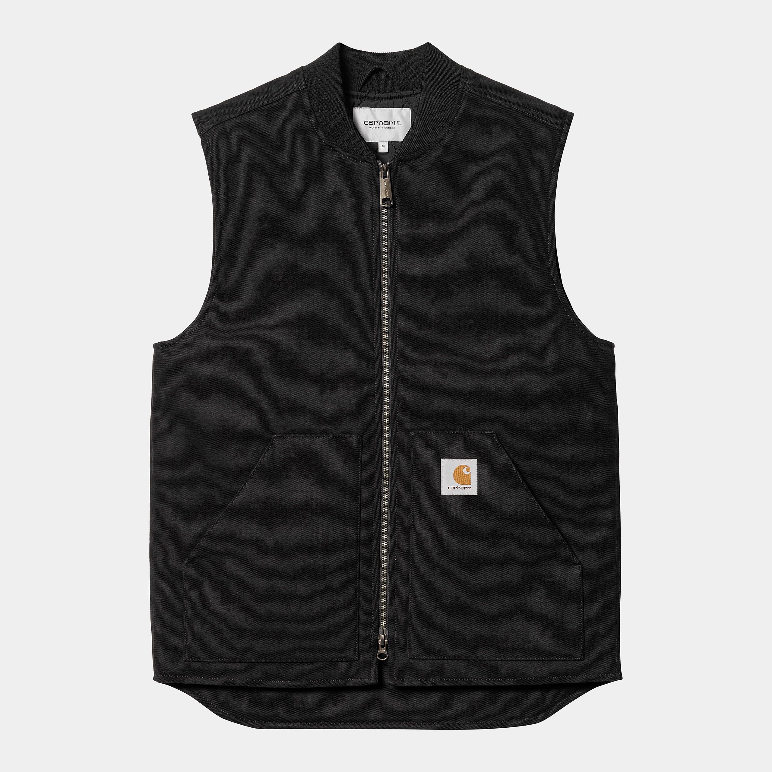 The Carhartt WIP Classic Vest - Black (rigid) by Carhartt Work in Progress is a sleeveless work vest with a front zipper, two large pockets, and a square logo patch on the front left pocket. Made from durable Dearborn Canvas, it features a straight hem and round neckline.