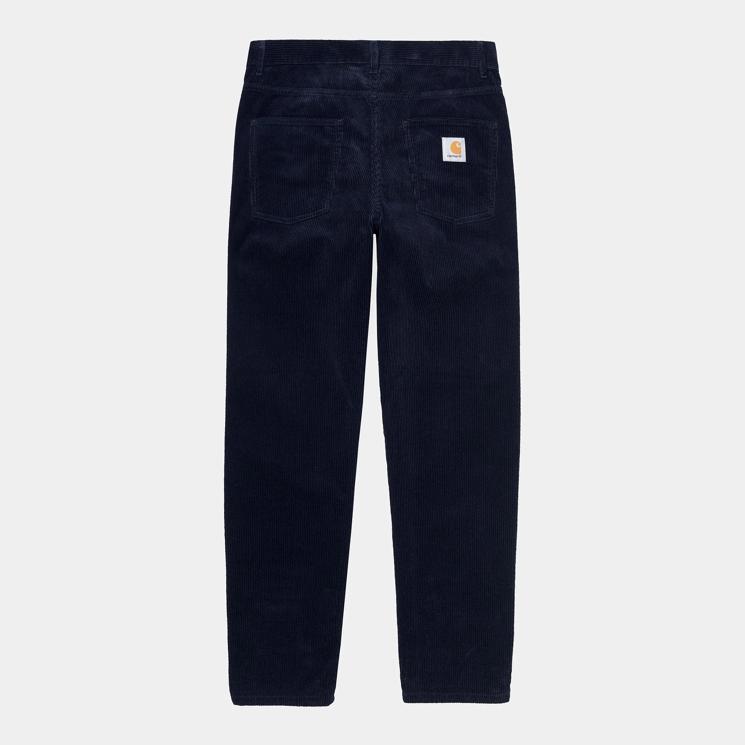 "Carhartt Newel Pant in Dunkelblau (Rinsed), Cordhose aus Baumwolle, lockere Passform, klassische Jeanshose in tiefem Marineblau bei Stickabush Berlin."