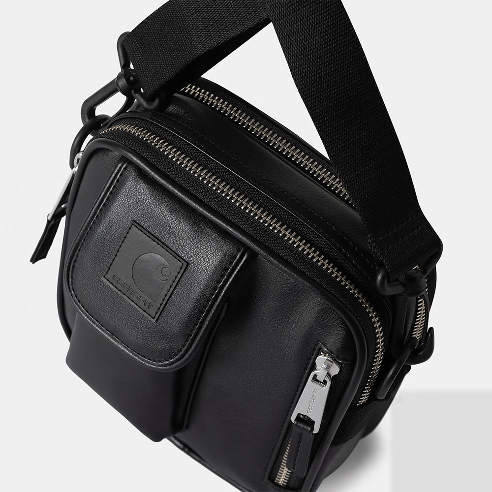 “Carhartt WIP Norwich Bag, Small – Black. Schwarze, kompakte Umhängetasche aus robustem Kunstleder-Material mit Reißverschluss und Fronttasche.“