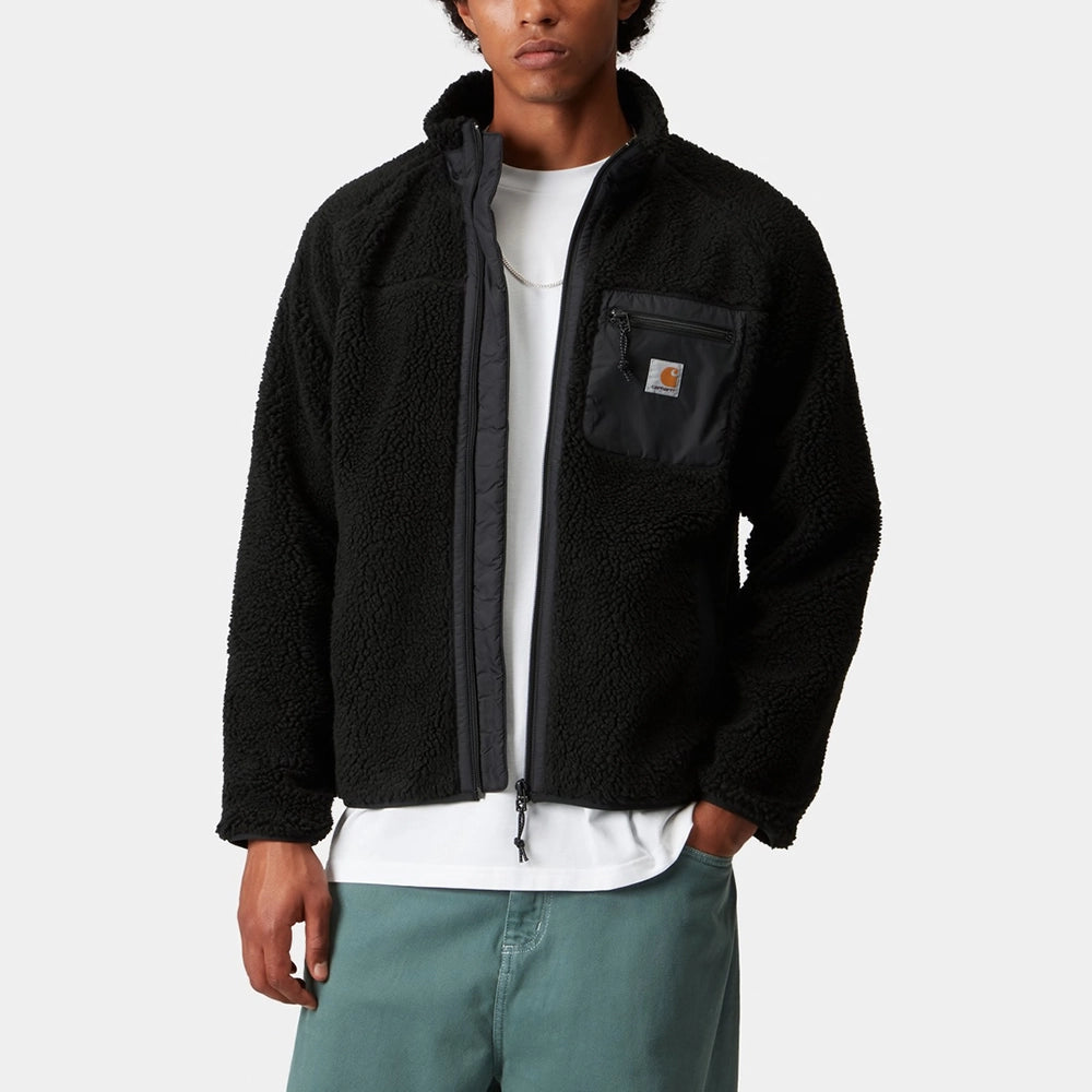 “Carhartt WIP Prentis Liner in Schwarz. Kuschelige Fleece-Jacke mit Nylon-Kontrastdetails und Square Label Logo.“
