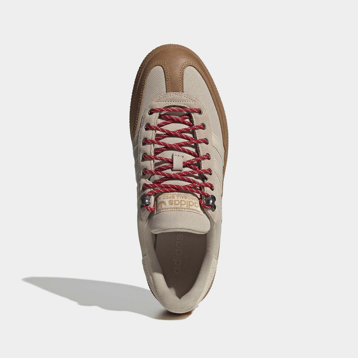 adidas Originals Handball Spezial WTR in Khaki Three / Bliss / Light Cinnamon – Topansicht des khakifarbenen Retro-Sneakers mit Metallösen und charakteristischen 3-Stripes.