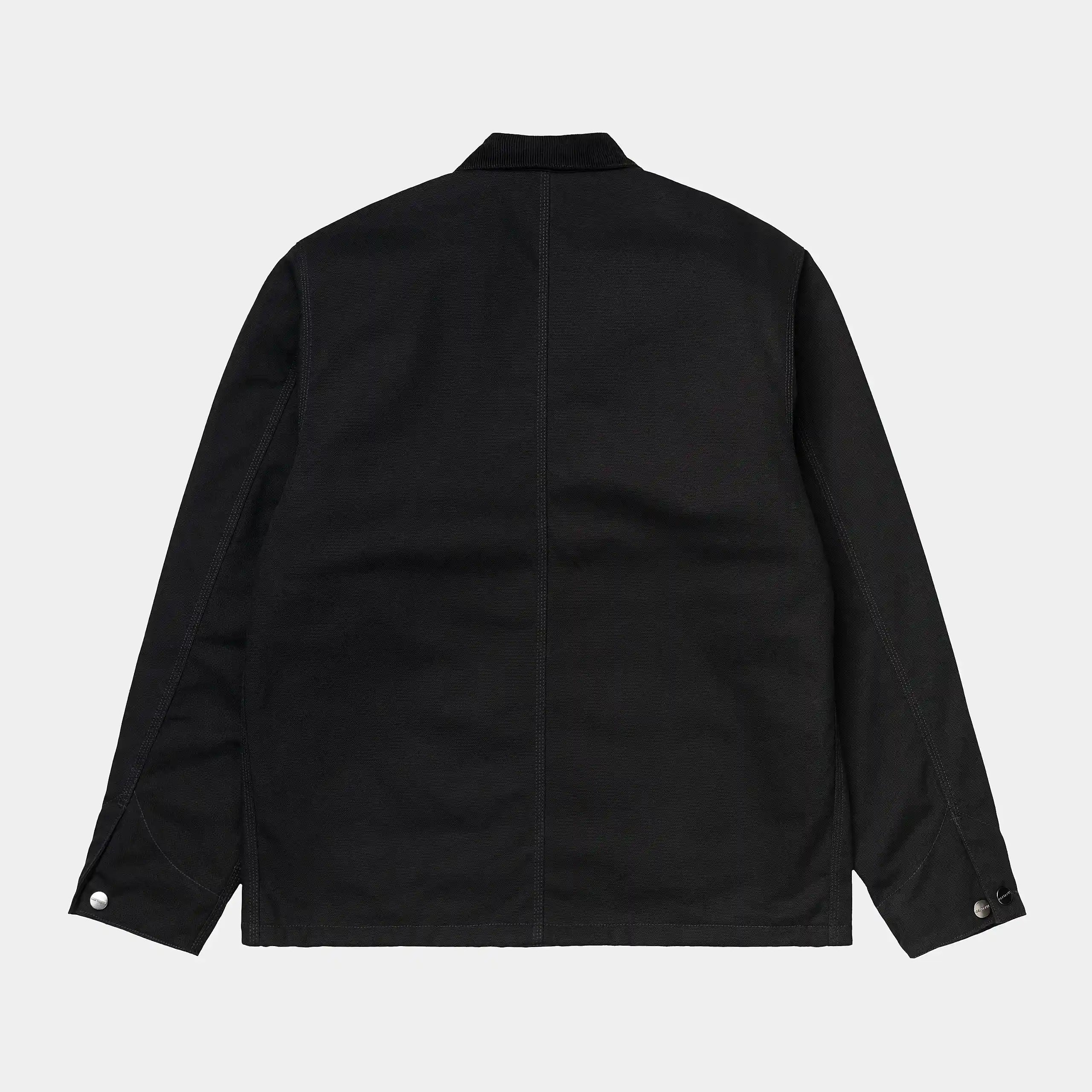 “Schwarzer ("rigid") Carhartt WIP Michigan Coat (Winter). Robuste Winterjacke aus ungefärbtem Baumwoll-Canvas, mit Steppfutter, Knopfverschluss und vier aufgesetzten Taschen.“