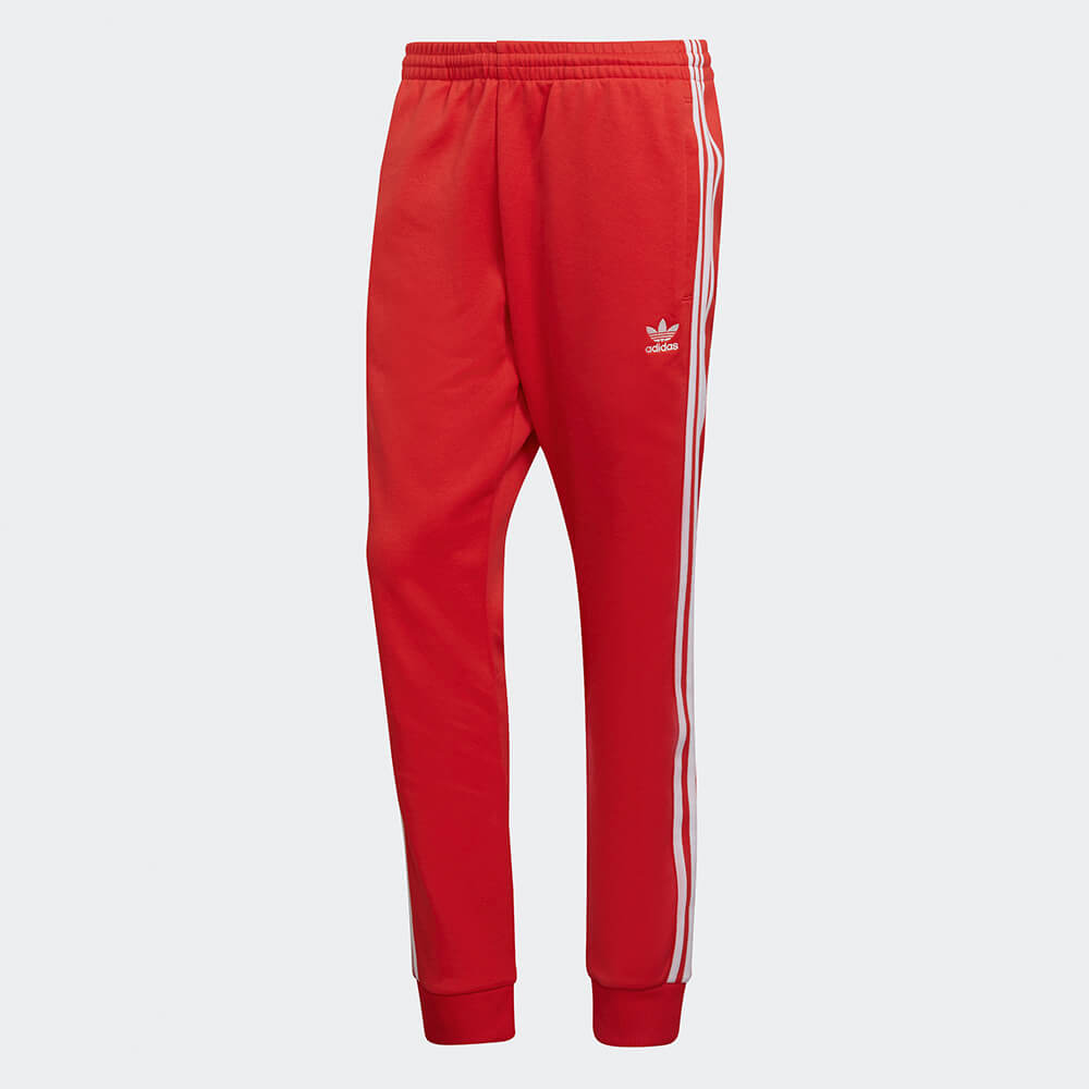 "Rote adidas Classics SST Track Pant mit weißen 3-Streifen und Trefoil-Logo, schmal zulaufendes Bein mit Rippbündchen bei Stickabush Berlin."