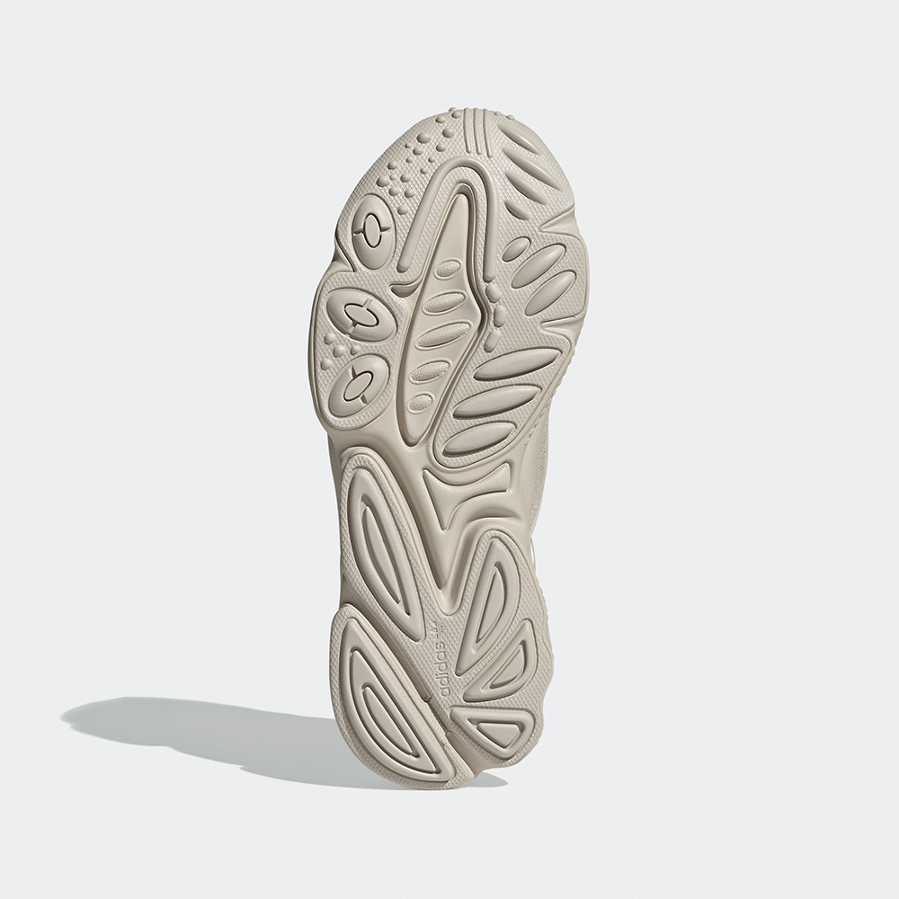 "Adidas Ozweego, Bliss (helles Beige/Creme), Mesh/Synthetik, futuristischer Sneaker mit wellenförmigen Overlays und markanter Sohle."